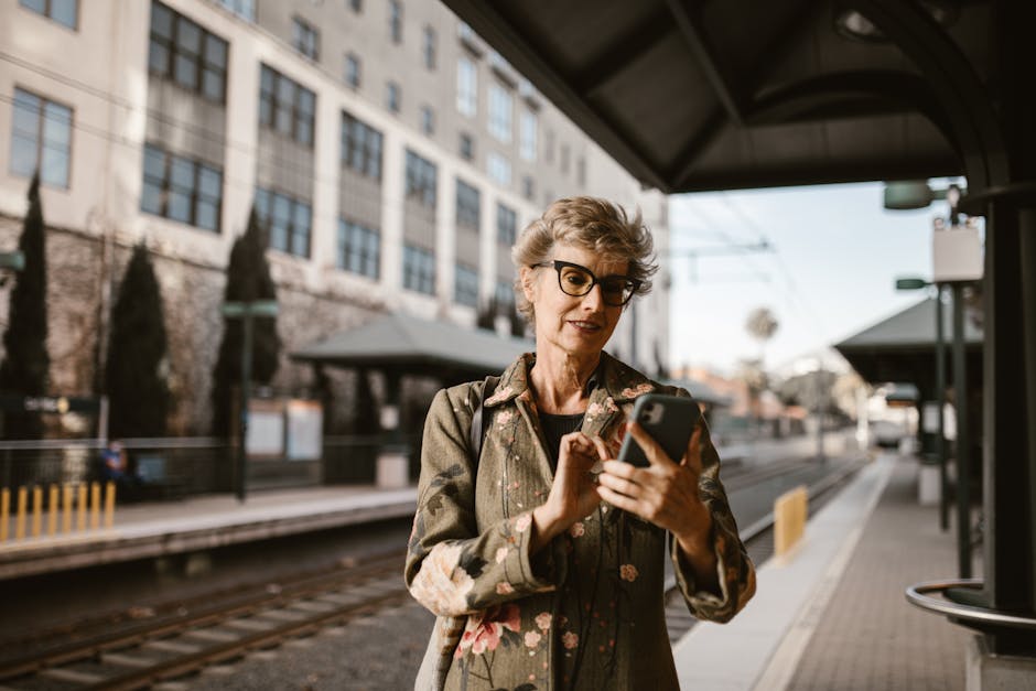 French woman using smartphone train station Lyon