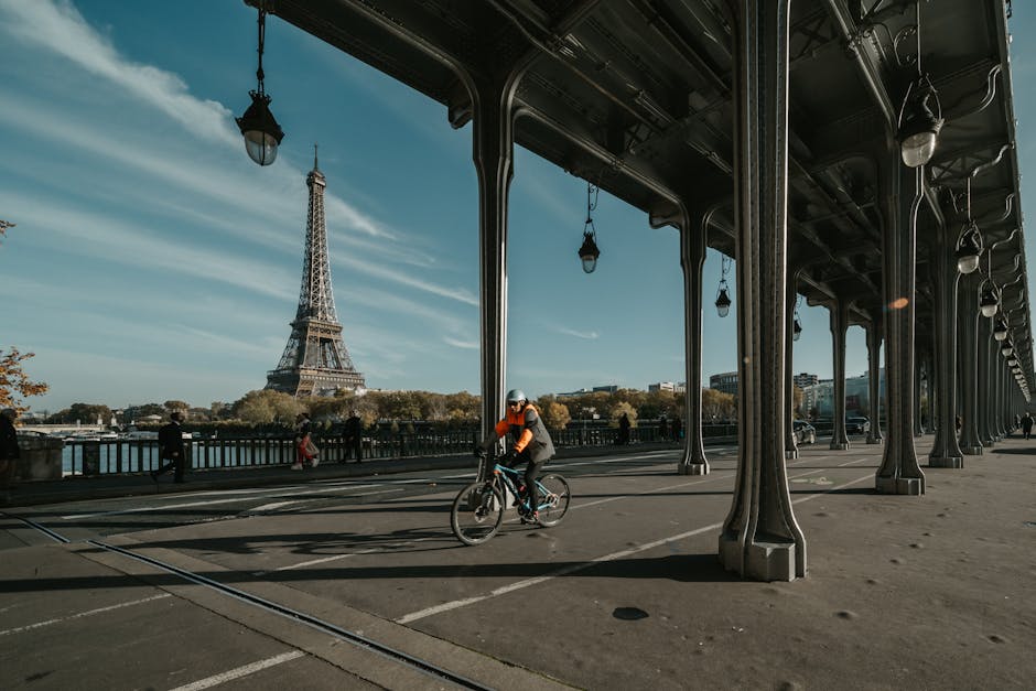 person using Velib bike rental near Eiffel Tower