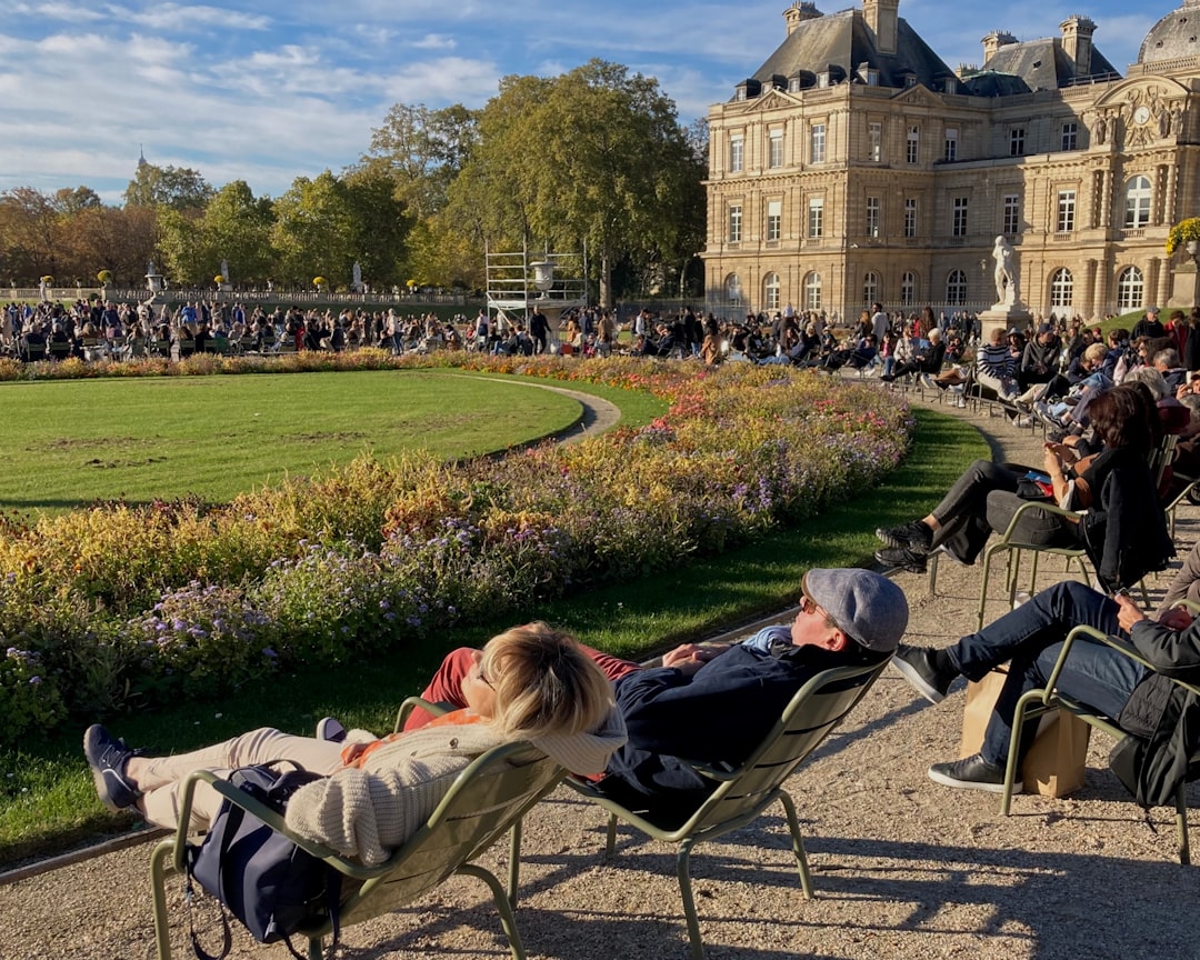 woman reading book Luxembourg Gardens Paris